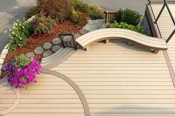 Curved composite decking TimberTech AZEK Harvest Collection in Brownstone with curved built in bench.