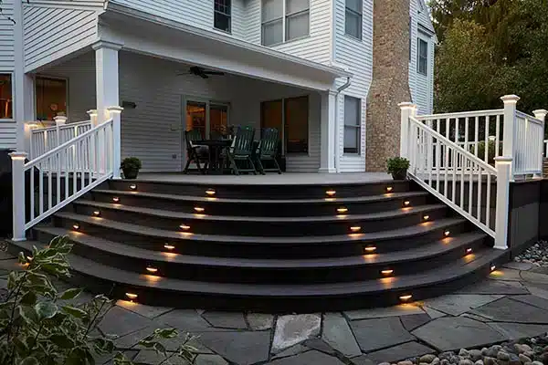 TimberTech Vintage Collection in Coastline, Mahogany, Dark Hickory wide curved staircase with in deck light